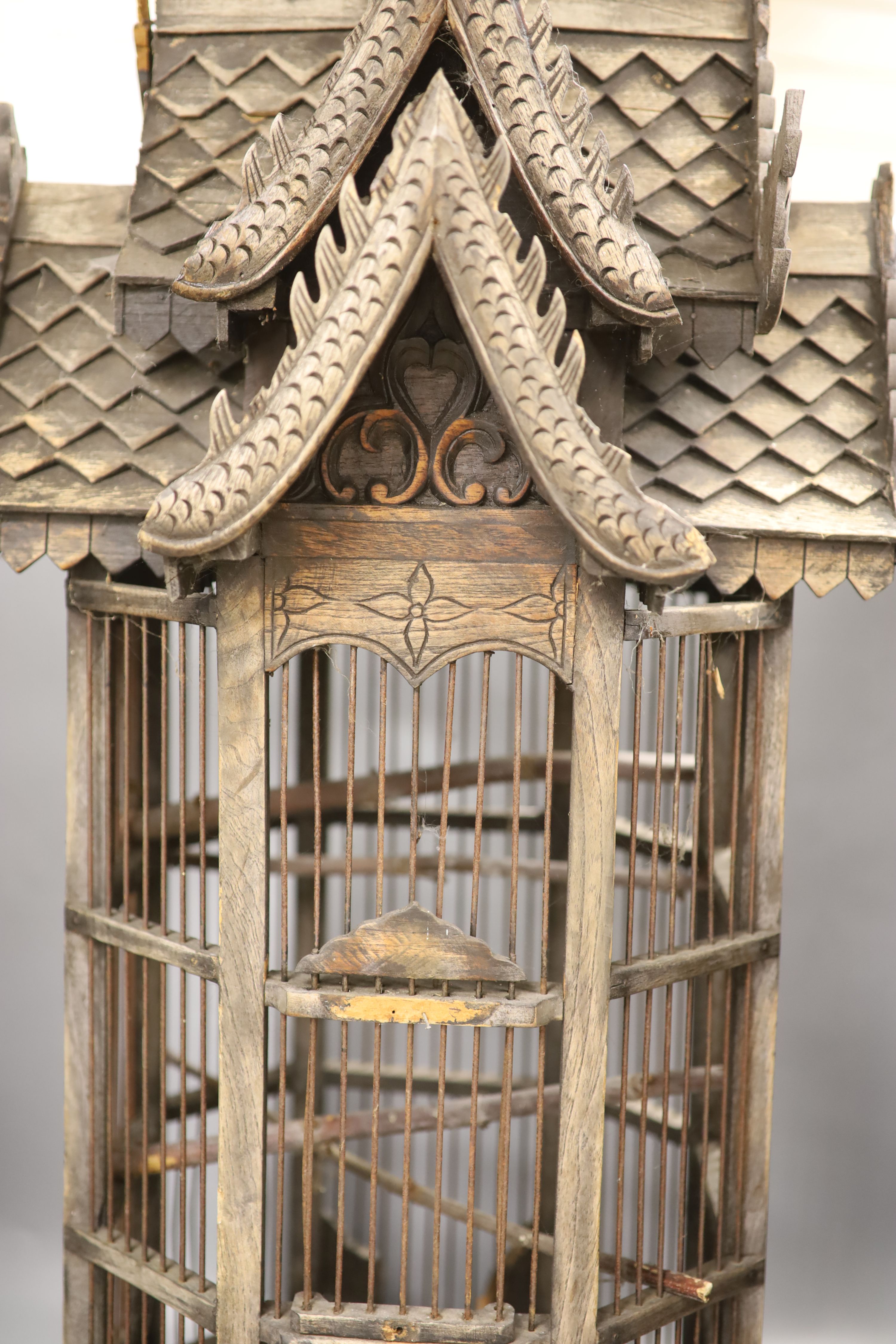 A carved wood birdcage, in Chinese style, height 80cm